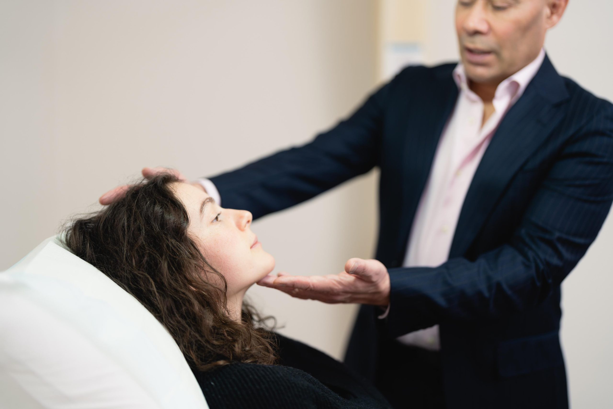 Dr. Sim Lew-Gor - Plastic Surgeon in Melbourne and Wagga Wagga Conducting a Facial Assessment